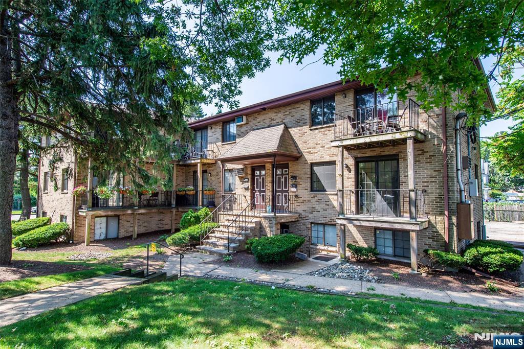 79 Getty Avenue, Unit 4B Clifton, NJ 07011 - Photo 9 of 30 front view of a house with a yard