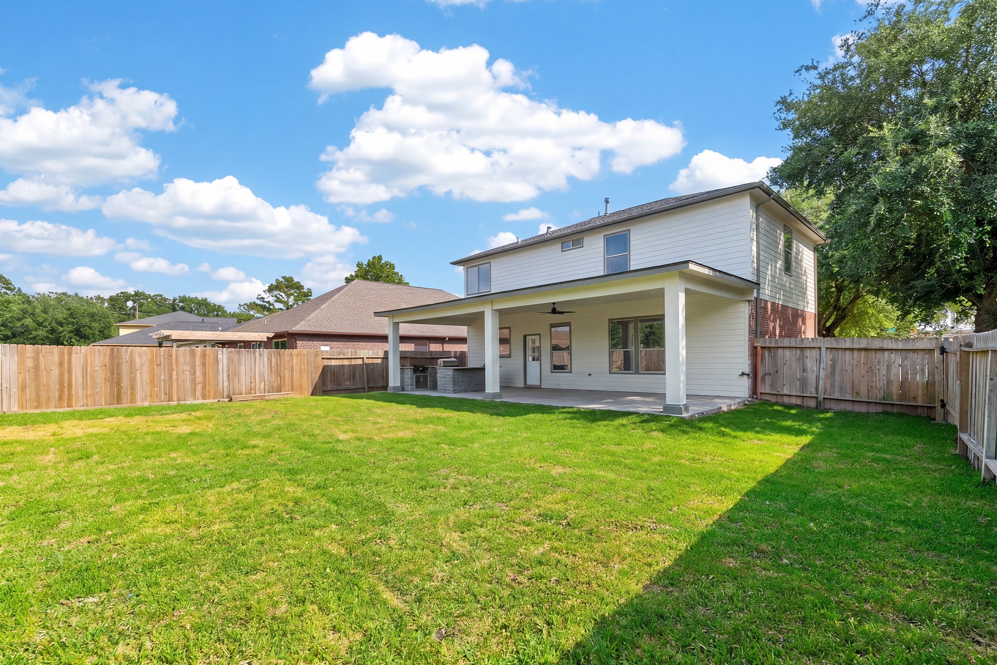 918 Ivycroft Lane Spring, TX 77373 - Photo 32 of 33 a backyard of a house with table and chairs
