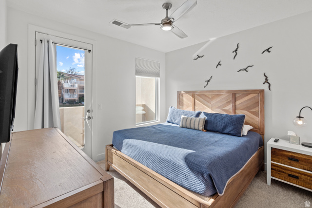 1122 South 1790th West, Unit 1 St. George, UT 84770 - Photo 25 of 37 Bedroom featuring a private balcony, ceiling fan, and carpeted flooring