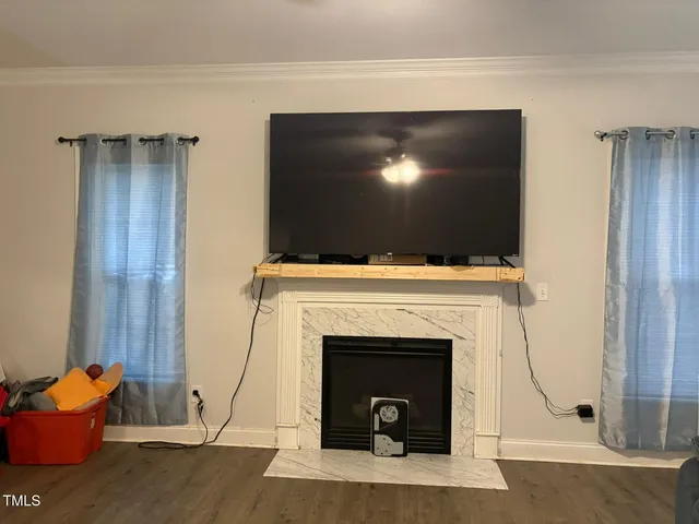 a view of a livingroom with wooden floor