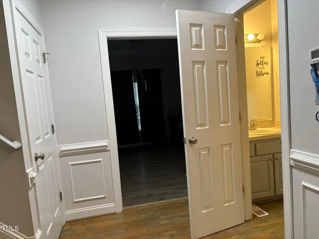 a spacious bedroom with a bed and a couch