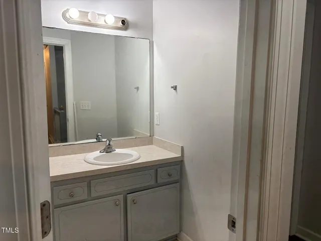 a view of a house with wooden fence