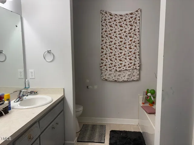 a view of a backyard with plants and a patio