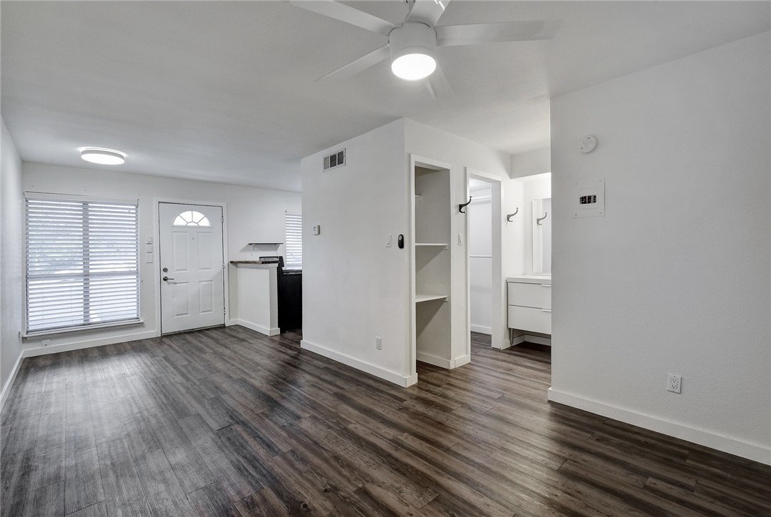 4111 Avenue A, Unit 108 Austin, TX 78751 - Photo 1 of 17 an empty room with wooden floor closet and windows