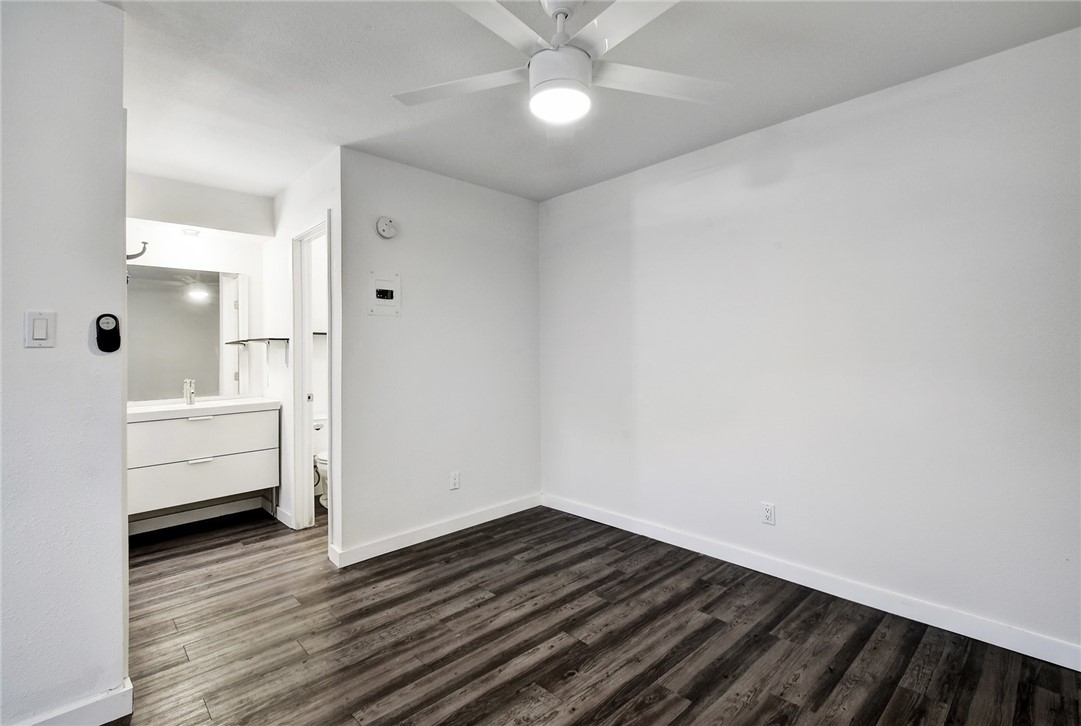 4111 Avenue A, Unit 108 Austin, TX 78751 - Photo 11 of 17 a view of a room with wooden floor and white walls
