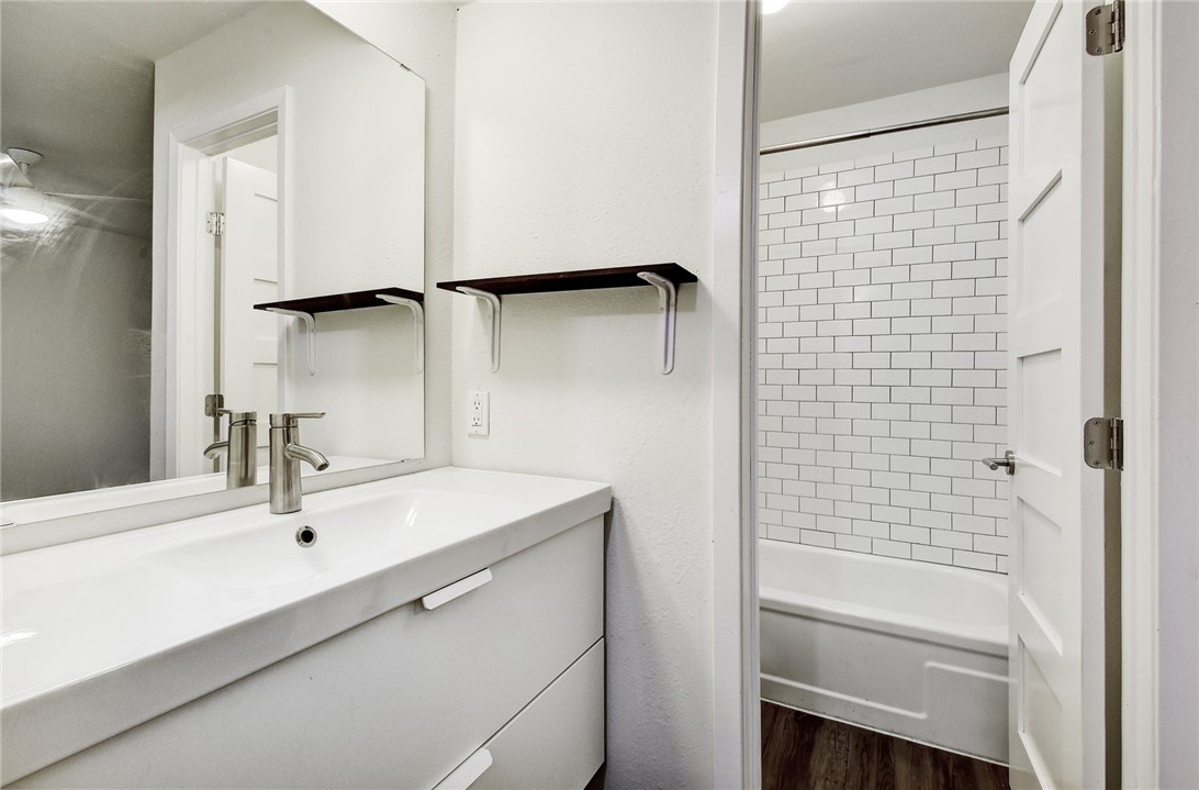 4111 Avenue A, Unit 108 Austin, TX 78751 - Photo 14 of 17 a bathroom with a sink and a mirror