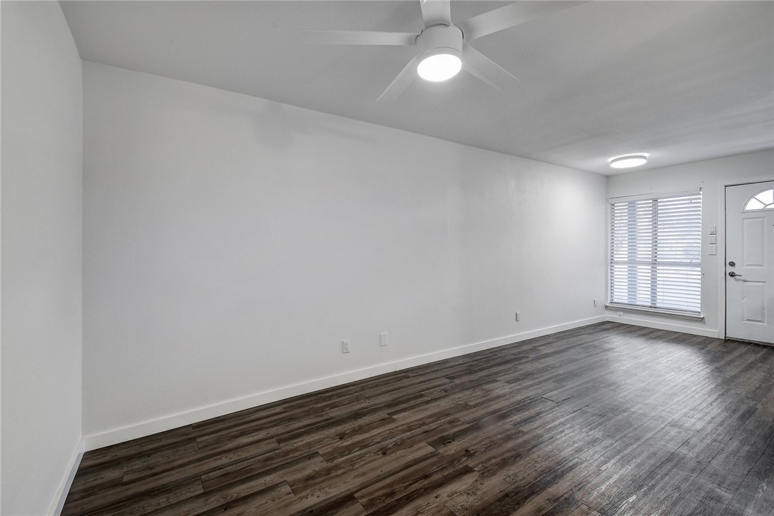 4111 Avenue A, Unit 108 Austin, TX 78751 - Photo 10 of 17 a view of an empty room with wooden floor and a window