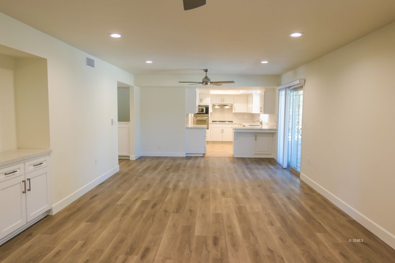 736 West Howell Avenue Ridgecrest, CA 93555 - Photo 12 of 50 a room with stainless steel appliances wooden floors and kitchen view