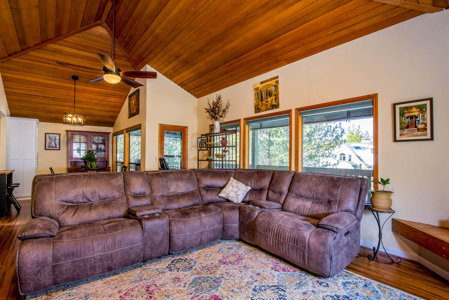 17704 Rogue Lane Sunriver, OR 97707 - Photo 9 of 26 a living room with furniture a flat screen tv and a large window