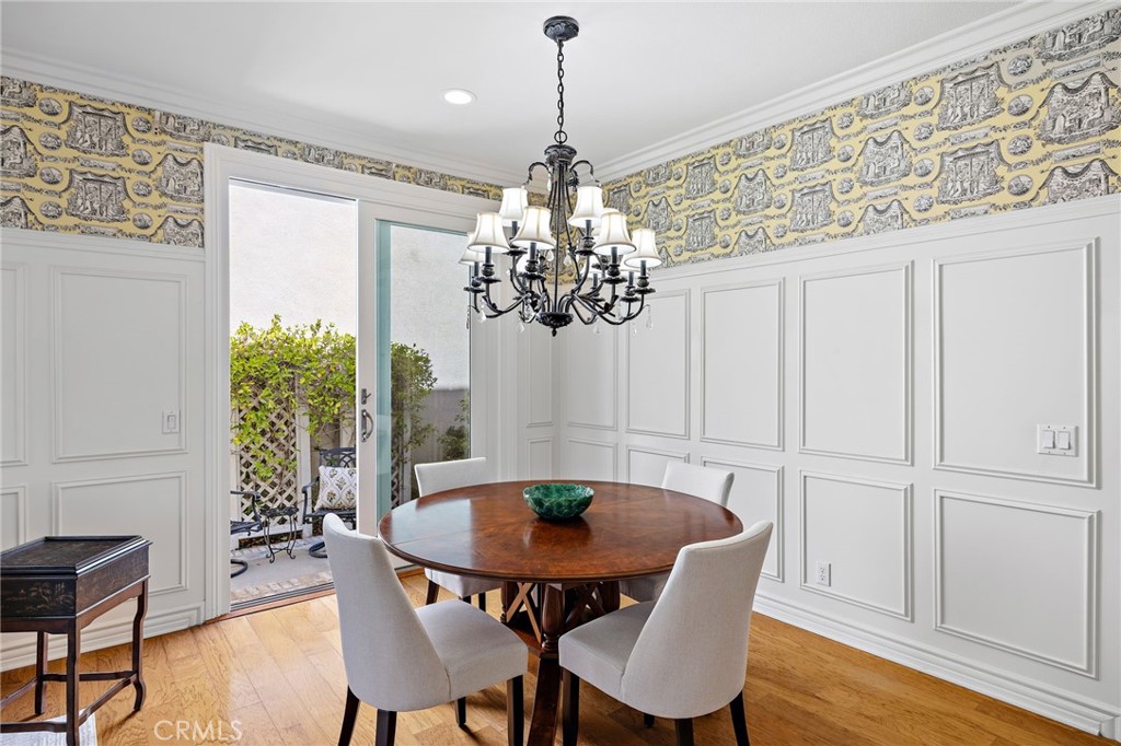 30 Baudin Circle Ladera Ranch, CA 92694 - Photo 13 of 75 a dining room with furniture potted plants and wooden floor