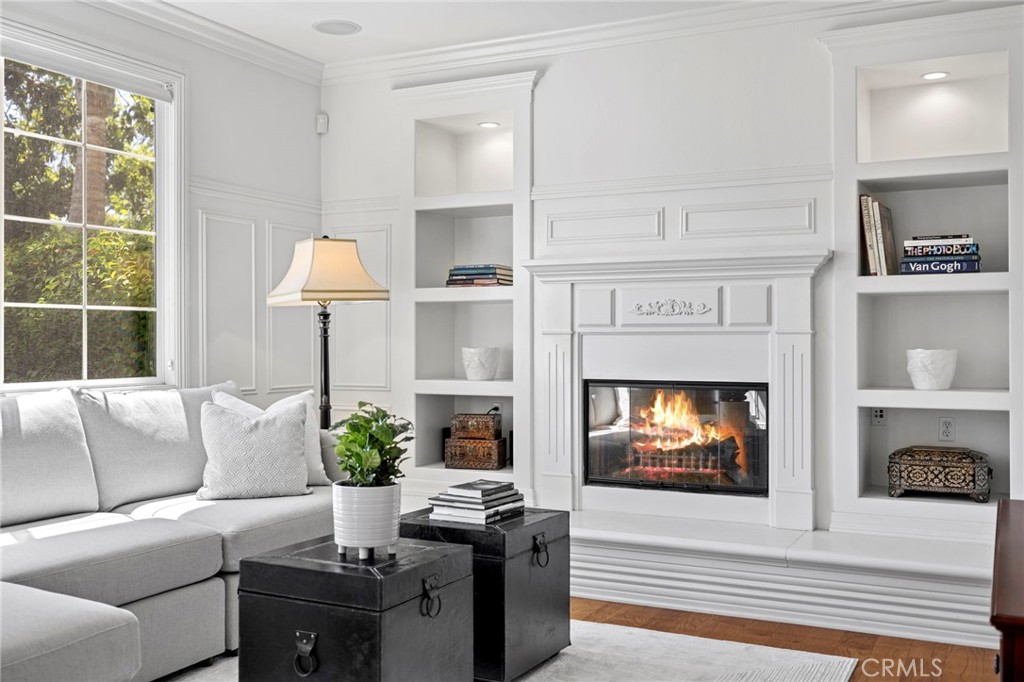30 Baudin Circle Ladera Ranch, CA 92694 - Photo 18 of 75 a living room with furniture a fireplace and a flat screen tv