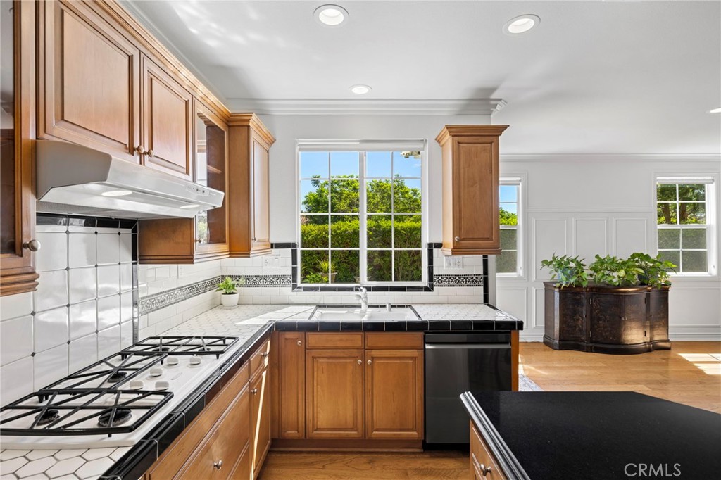 30 Baudin Circle Ladera Ranch, CA 92694 - Photo 25 of 75 a kitchen with stainless steel appliances granite countertop a stove and a refrigerator