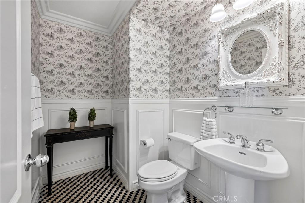 30 Baudin Circle Ladera Ranch, CA 92694 - Photo 26 of 75 a bathroom with a sink a toilet and a mirror
