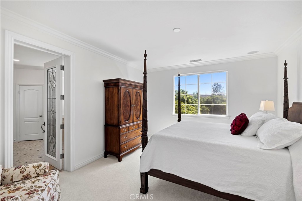 30 Baudin Circle Ladera Ranch, CA 92694 - Photo 28 of 75 a bed room with a bed and a window