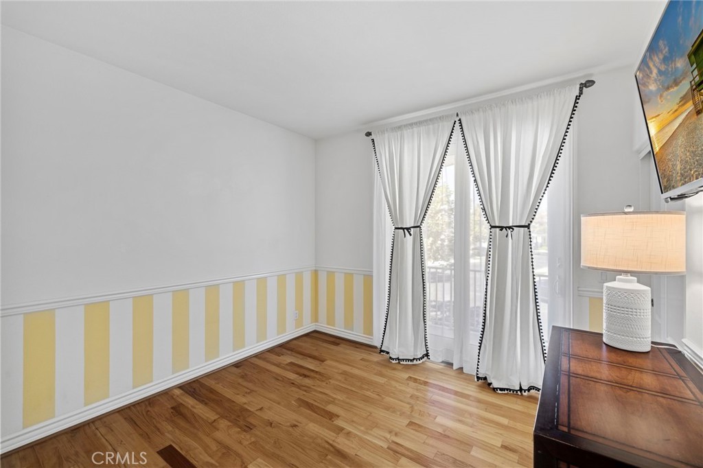 30 Baudin Circle Ladera Ranch, CA 92694 - Photo 34 of 75 a view of an empty room with wooden floor and a window