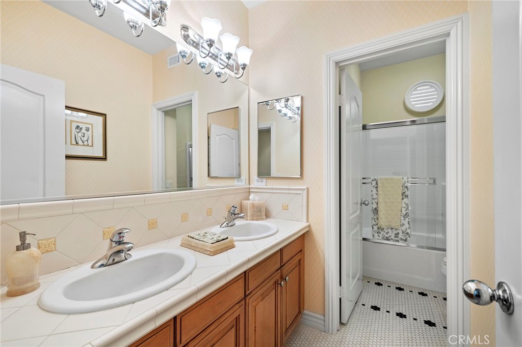 30 Baudin Circle Ladera Ranch, CA 92694 - Photo 35 of 75 a bathroom with a sink double vanity and a mirror