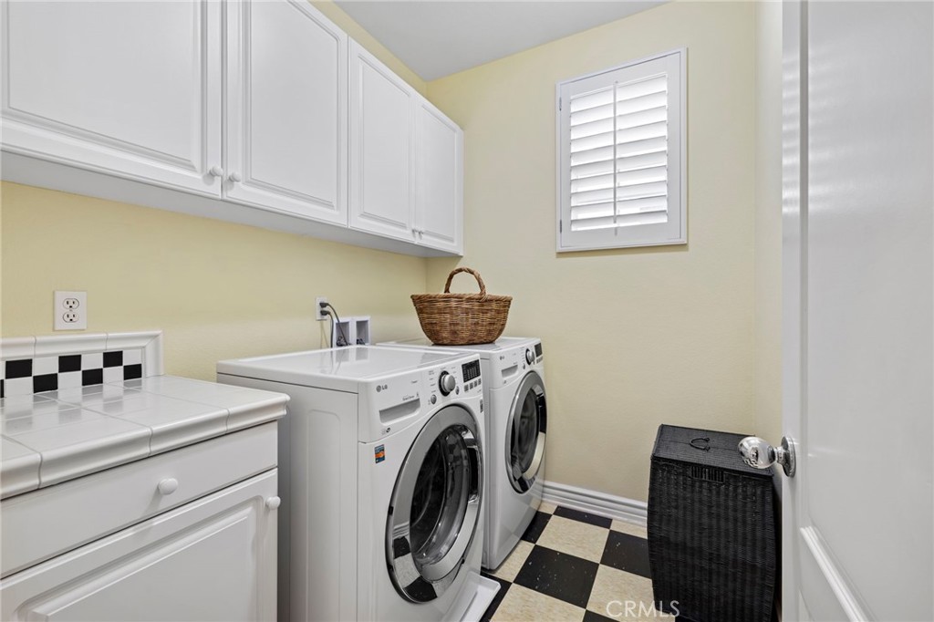 30 Baudin Circle Ladera Ranch, CA 92694 - Photo 38 of 75 a utility room with dryer and washer