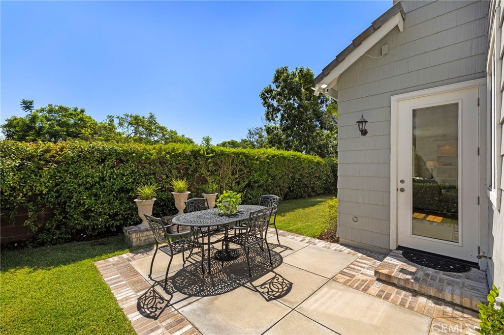 30 Baudin Circle Ladera Ranch, CA 92694 - Photo 40 of 75 a view of a patio with table and chairs and potted plants