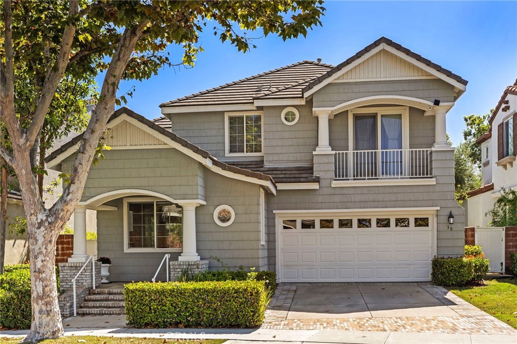 30 Baudin Circle Ladera Ranch, CA 92694 - Photo 4 of 75 a front view of a house with a yard and garage