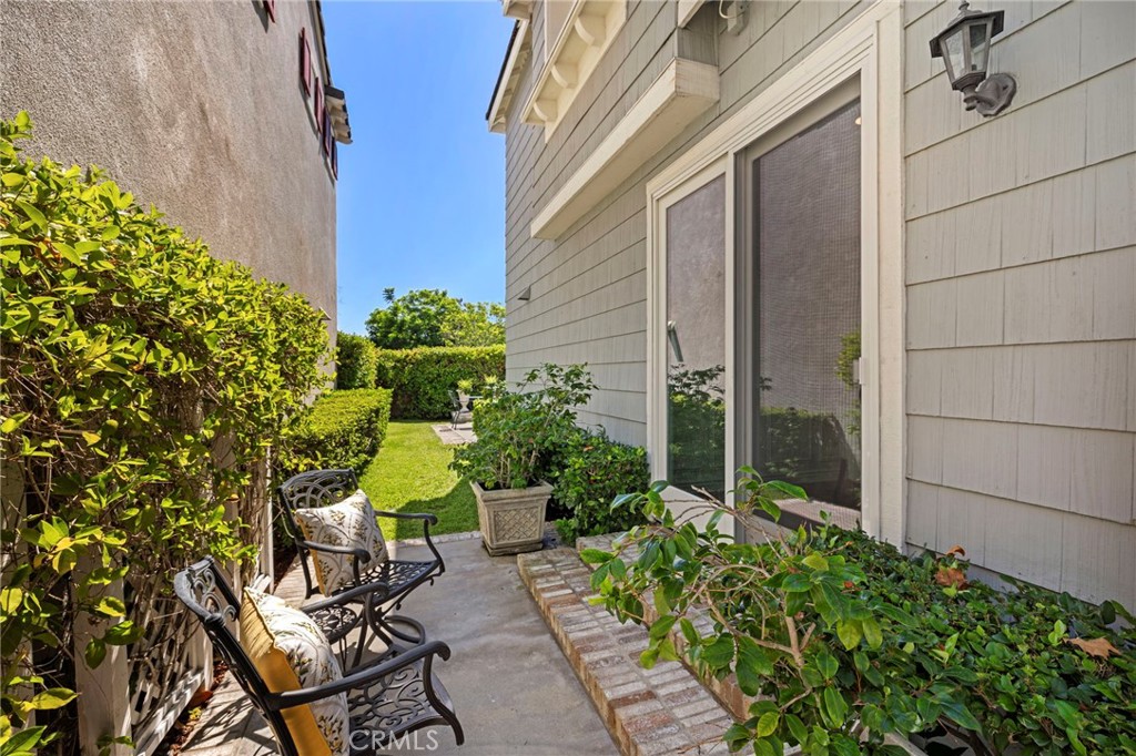 30 Baudin Circle Ladera Ranch, CA 92694 - Photo 44 of 75 a view of a chair and table in backyard of the house