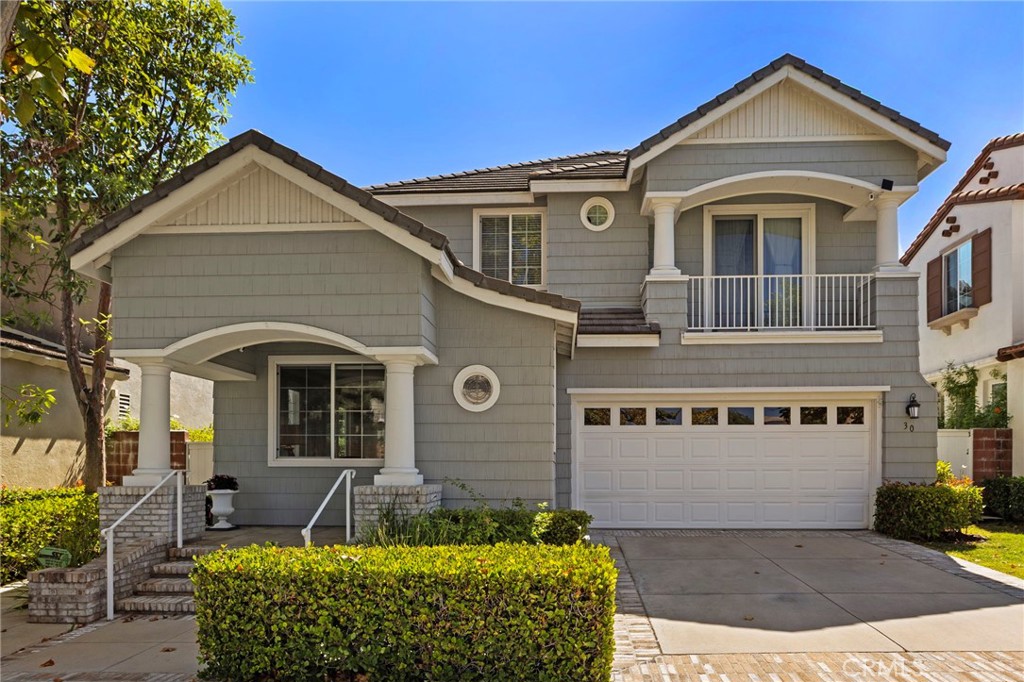 30 Baudin Circle Ladera Ranch, CA 92694 - Photo 49 of 75 a front view of a house with garden