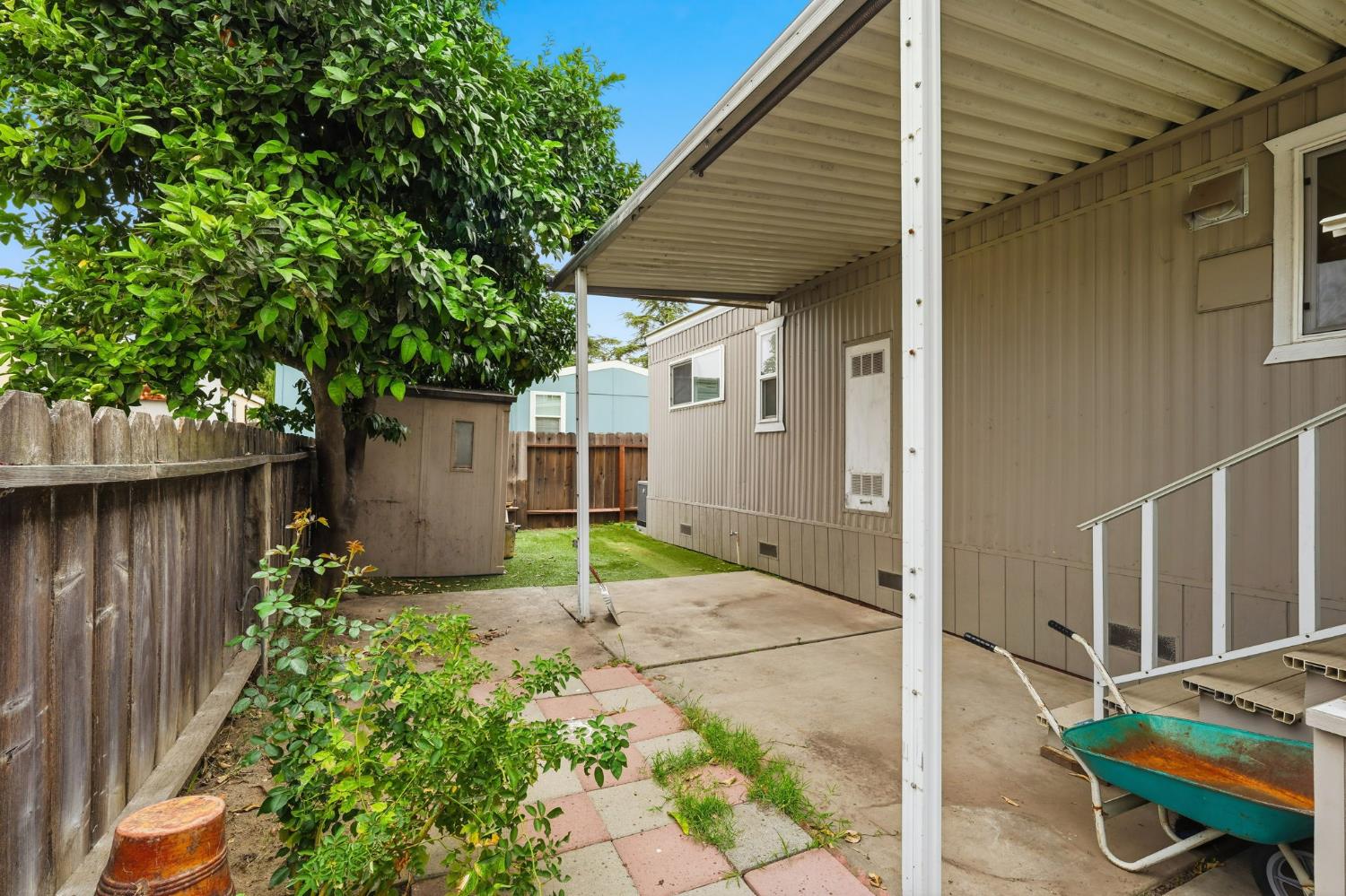 15820 Harlan Road, Unit 85 Lathrop, CA 95330 - Photo 19 of 27 a backyard of a house with seating space
