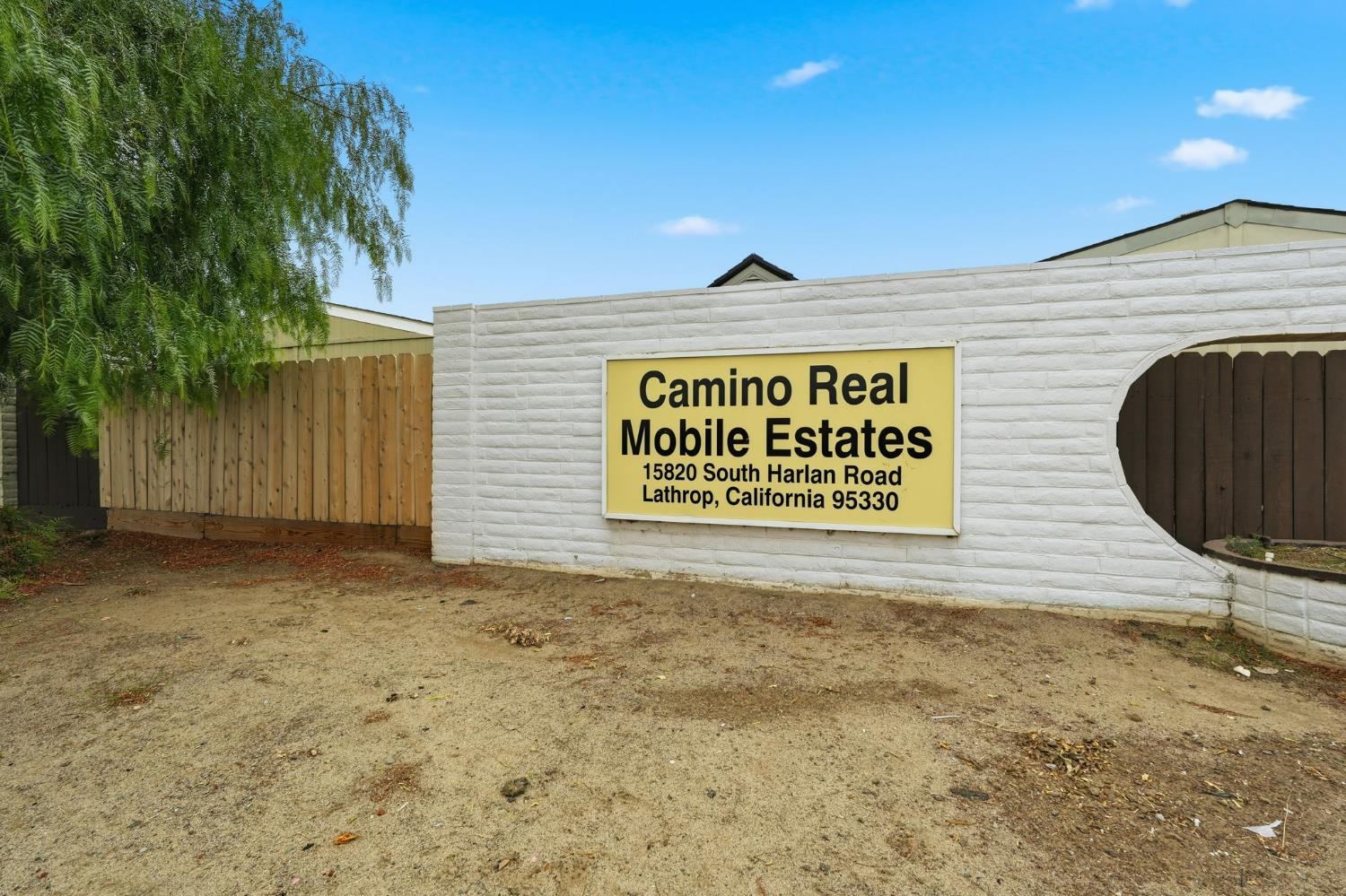 15820 Harlan Road, Unit 85 Lathrop, CA 95330 - Photo 25 of 27 a sign that is on a brick wall