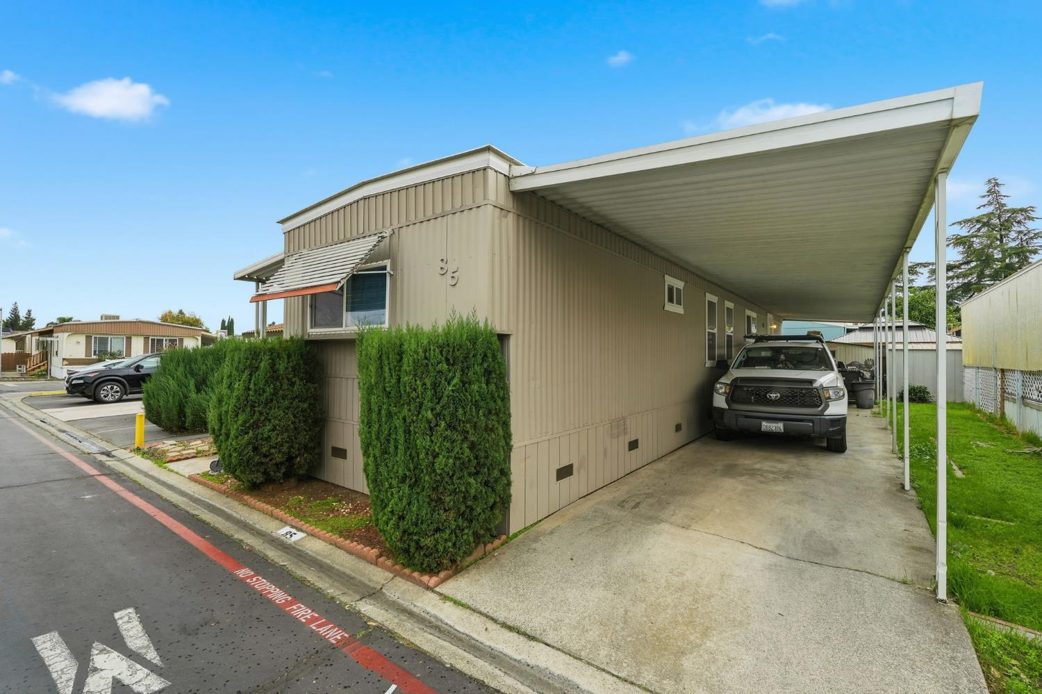 15820 Harlan Road, Unit 85 Lathrop, CA 95330 - Photo 3 of 27 a view of a car garage