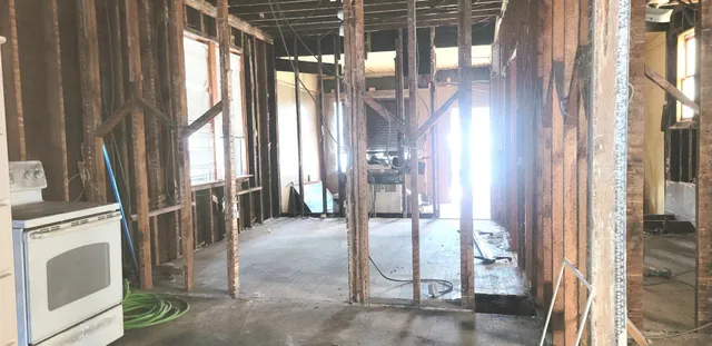 a living room filled with furniture and a chandelier
