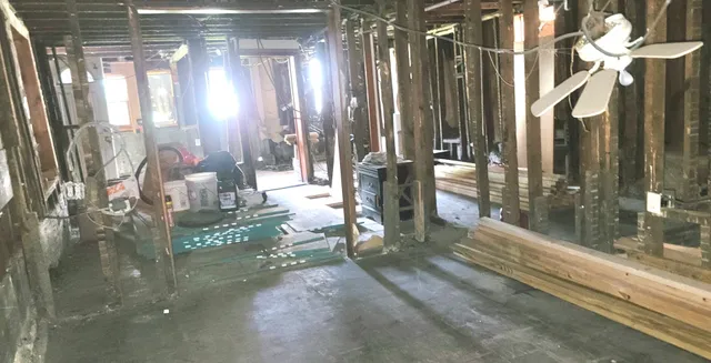 a bathroom with a toilet sink and a mirror