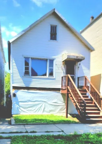 a view of front door of house with yard