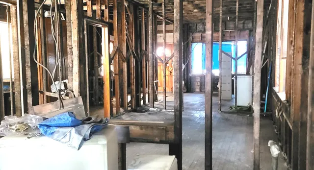 a view of a room with wooden floor