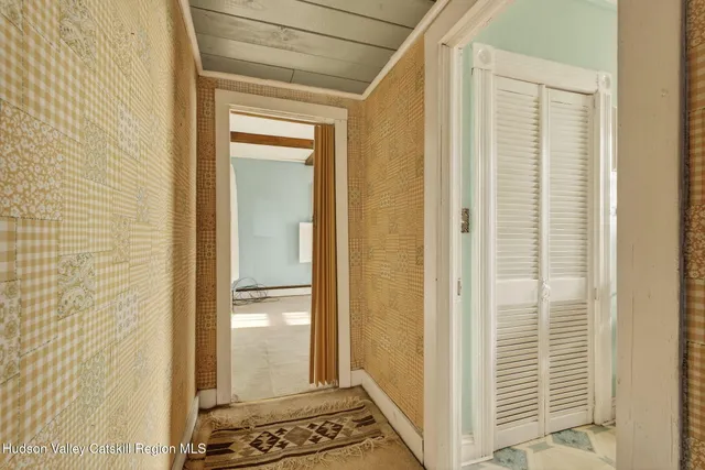 a view of a bathroom with a glass door