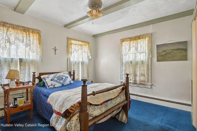 a bathroom with a sink a mirror and a shower