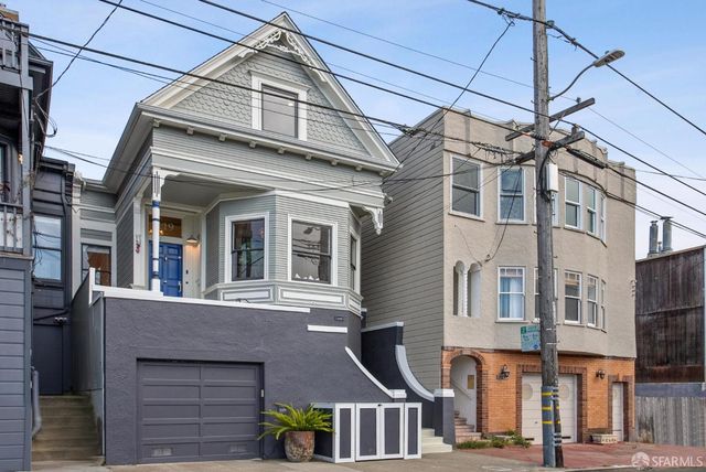 a front view of a house with entryway and wooden floor