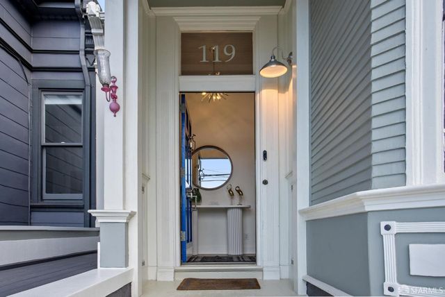 a living room with furniture or couch and a potted plant