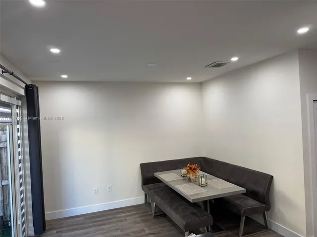 a room with furniture and wooden floor