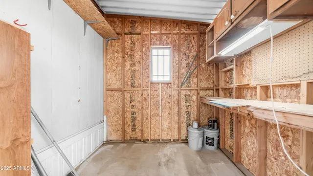 a kitchen with cabinets appliances a sink and a window