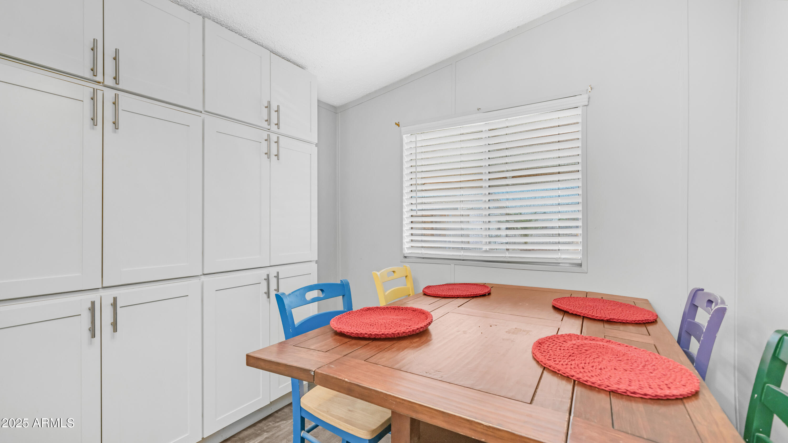 301 South Signal Butte Road, Unit 51 Apache Junction, AZ 85120 - Photo 16 of 32 a view of a dining room with furniture and a window