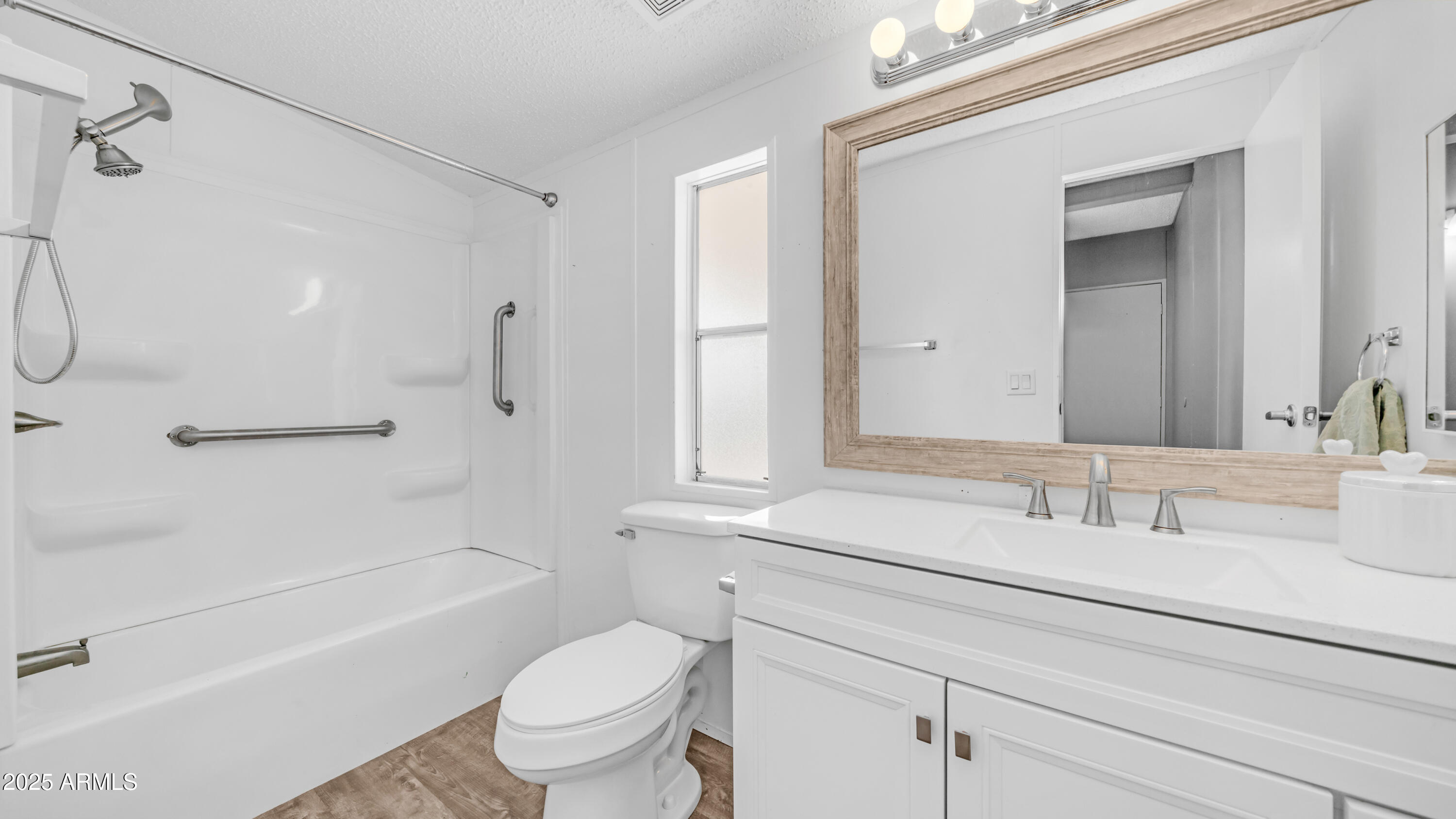 301 South Signal Butte Road, Unit 51 Apache Junction, AZ 85120 - Photo 18 of 32 a bathroom with a sink a toilet and a bathtub