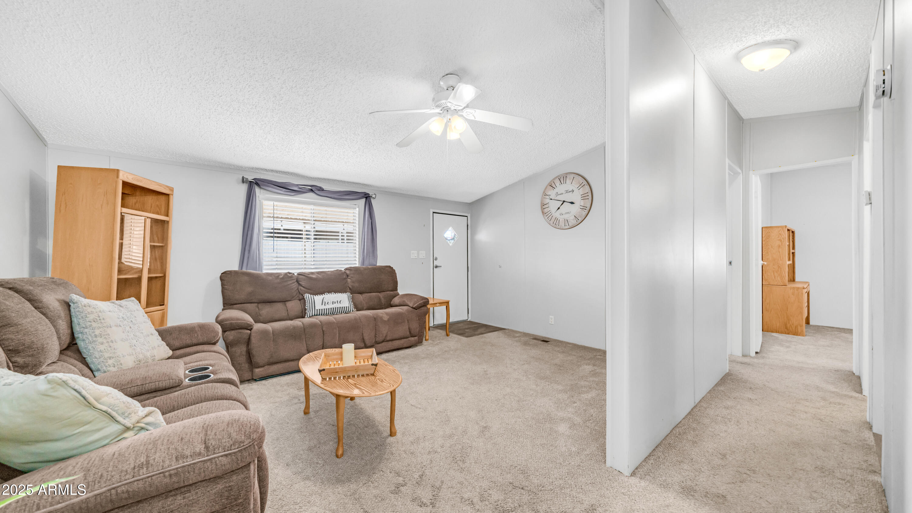 301 South Signal Butte Road, Unit 51 Apache Junction, AZ 85120 - Photo 19 of 32 a living room with furniture and window