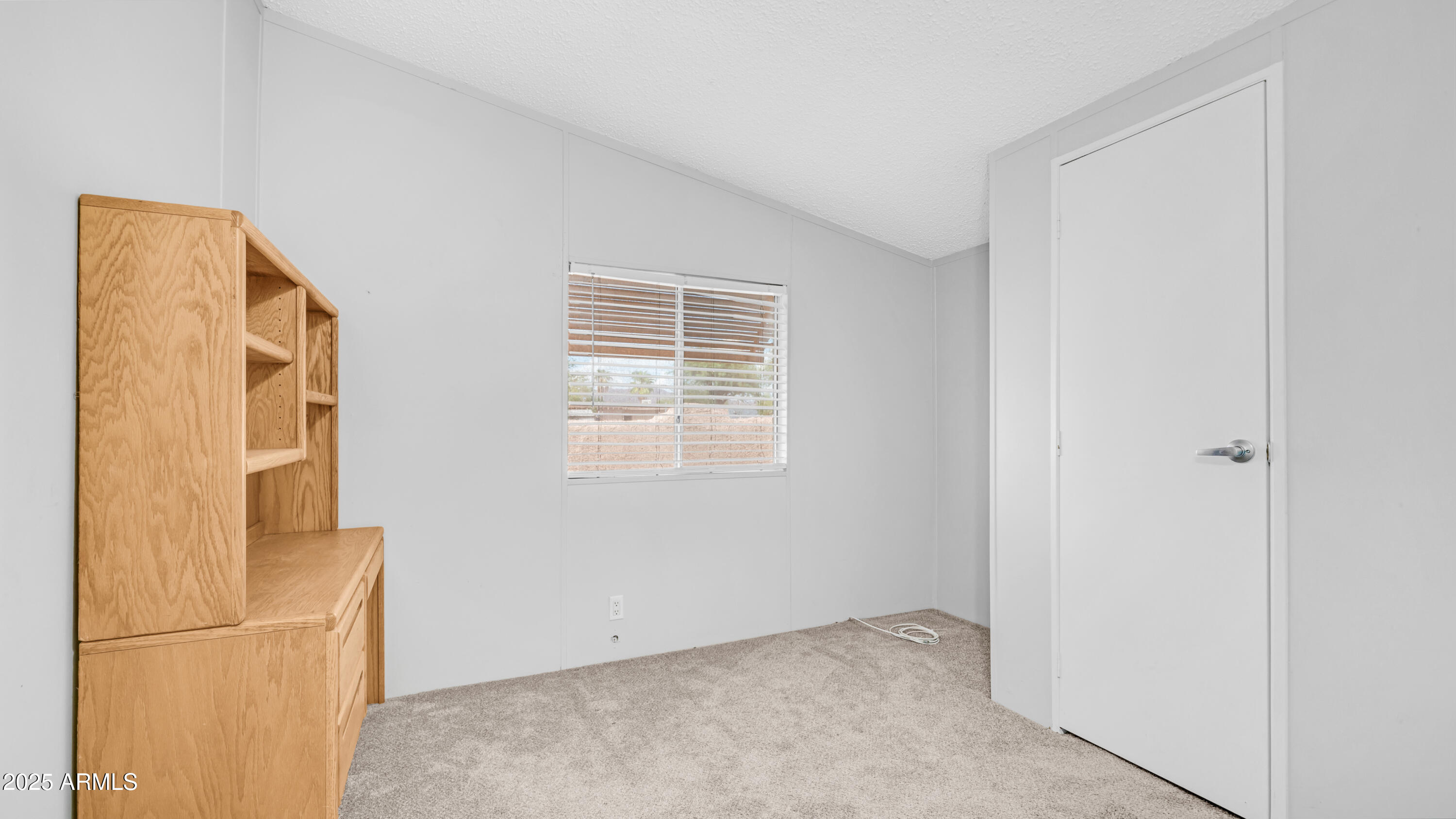 301 South Signal Butte Road, Unit 51 Apache Junction, AZ 85120 - Photo 23 of 32 a view of an empty room with a window