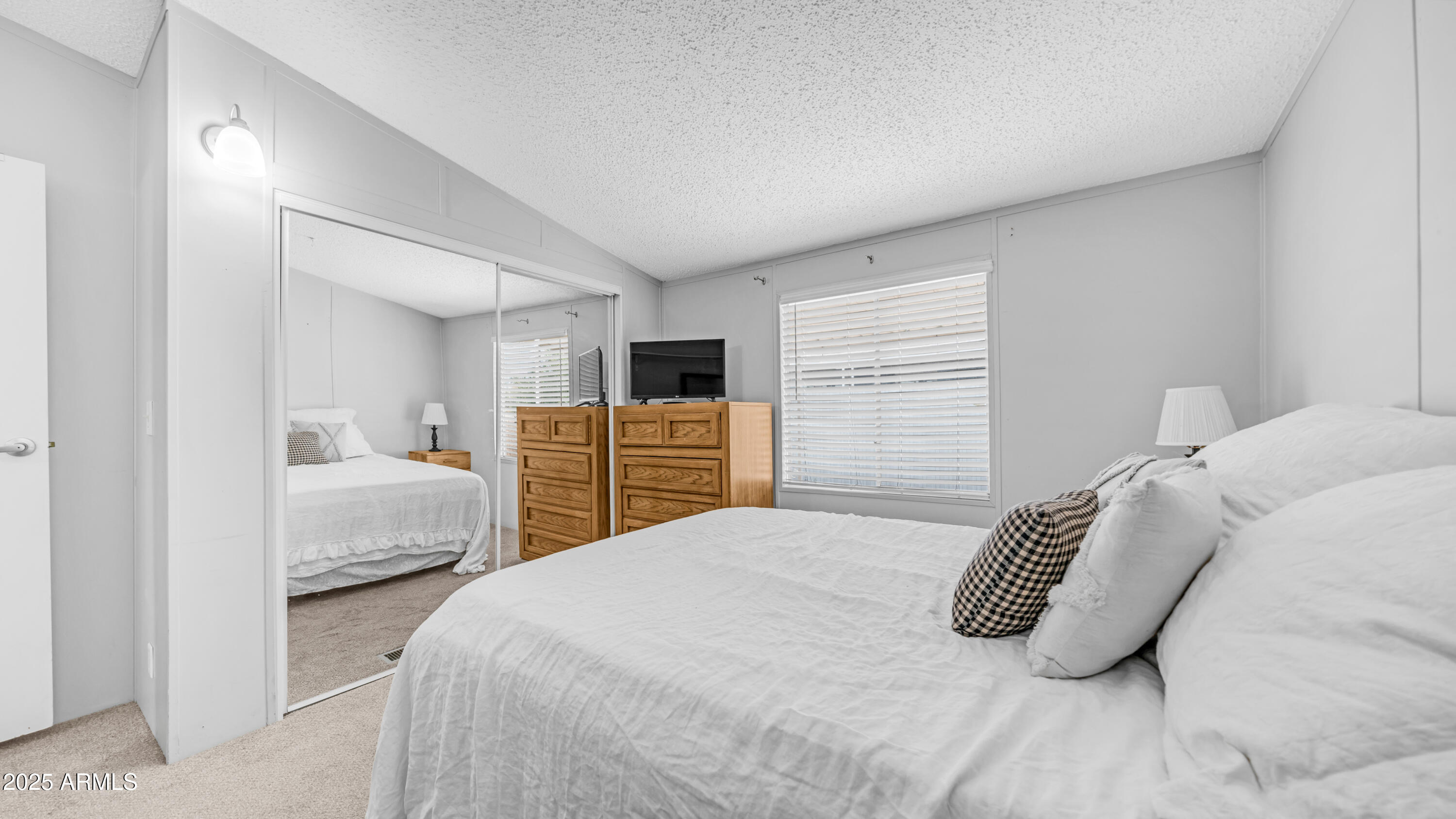 301 South Signal Butte Road, Unit 51 Apache Junction, AZ 85120 - Photo 25 of 32 a bedroom with a bed and window