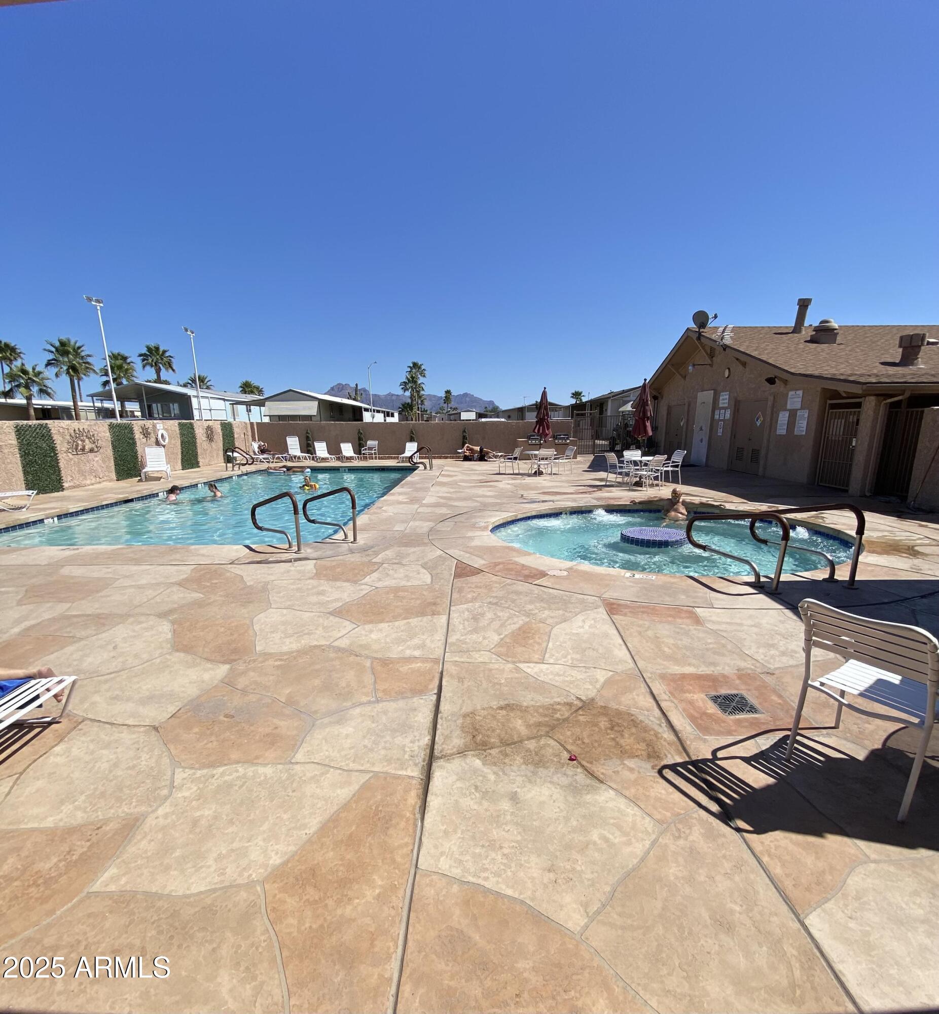301 South Signal Butte Road, Unit 51 Apache Junction, AZ 85120 - Photo 26 of 32 a view of a terrace with chairs