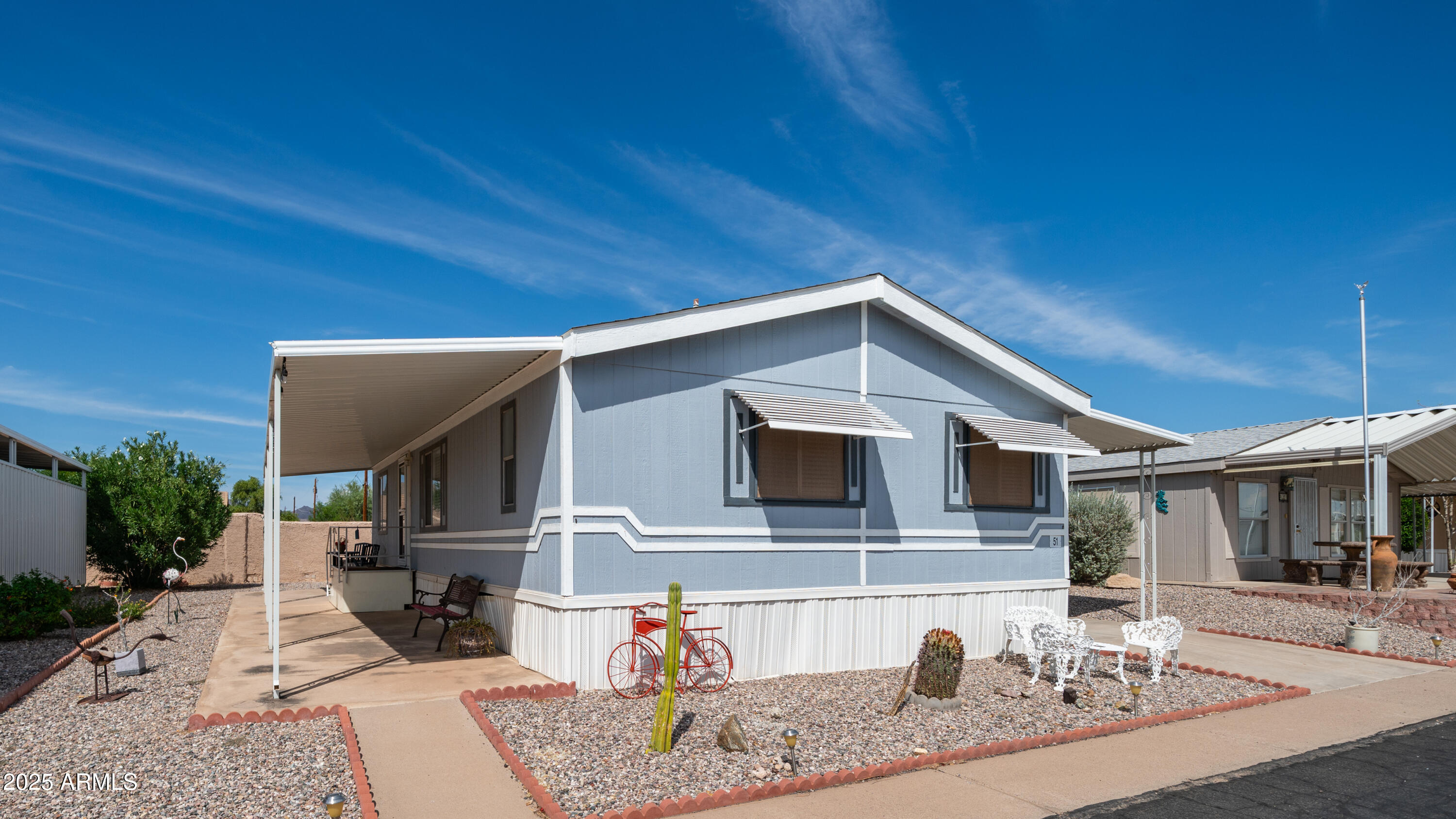 301 South Signal Butte Road, Unit 51 Apache Junction, AZ 85120 - Photo 5 of 32 a view of a house with a patio