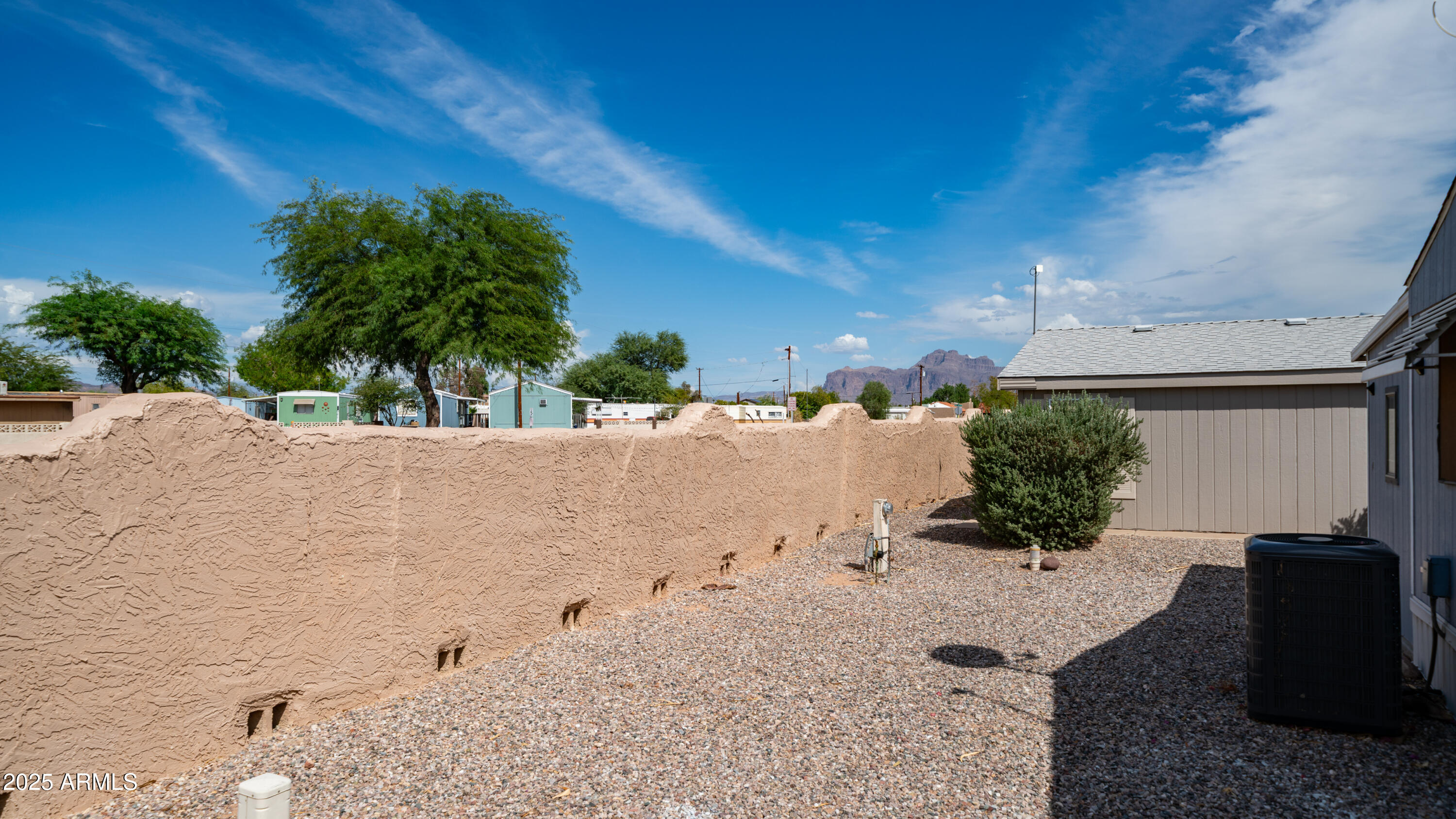 301 South Signal Butte Road, Unit 51 Apache Junction, AZ 85120 - Photo 8 of 32 a view of a backyard of the house