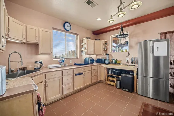 a kitchen with a sink appliances and cabinets