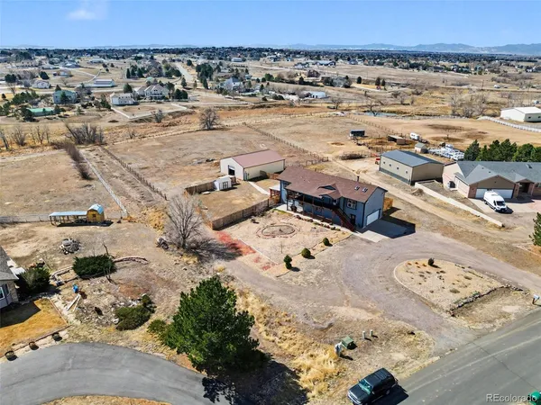 an aerial view of a parking space and city view