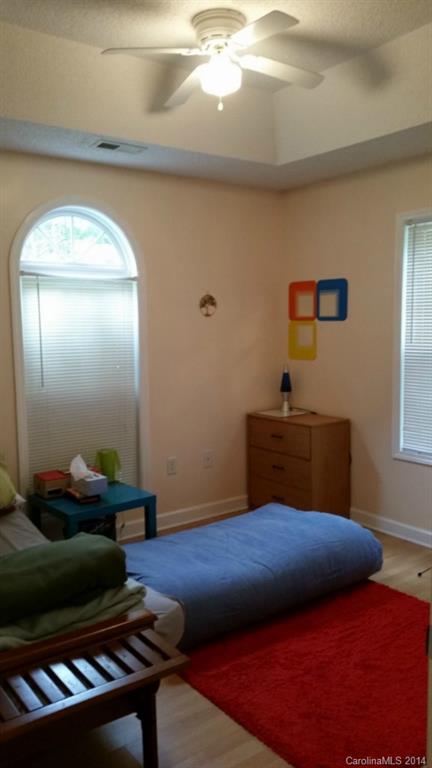 7003 Providence Road South Waxhaw, NC 28173 - Photo 8 of 20 a bedroom with a bed and a mirror