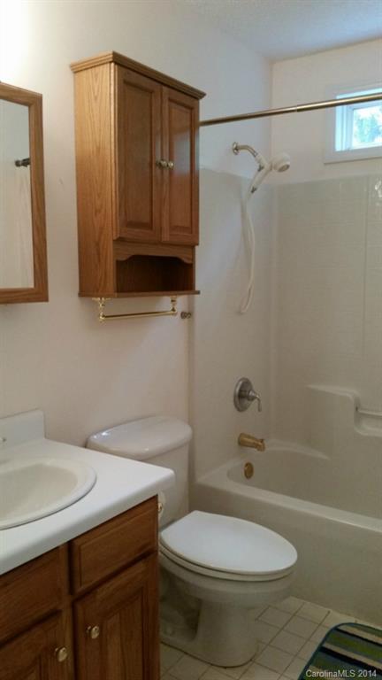 7003 Providence Road South Waxhaw, NC 28173 - Photo 9 of 20 a bathroom with a sink a toilet and shower